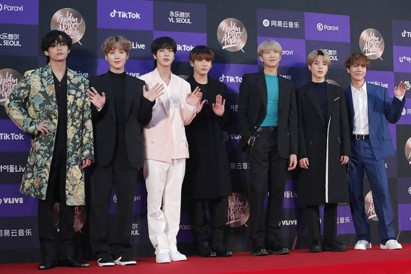 FILE - In this Jan. 5, 2020, file photo, members of South Korean K-Pop group BTS pose for photos during the Golden Disk Awards in Seoul, South Korea. BTS canceled a series of planned concerts in Seoul in April due to concerns about a soaring viral outbreak in South Korea, the bandu2019s management agency said Friday, Feb. 28, 2020. Photo: AP
