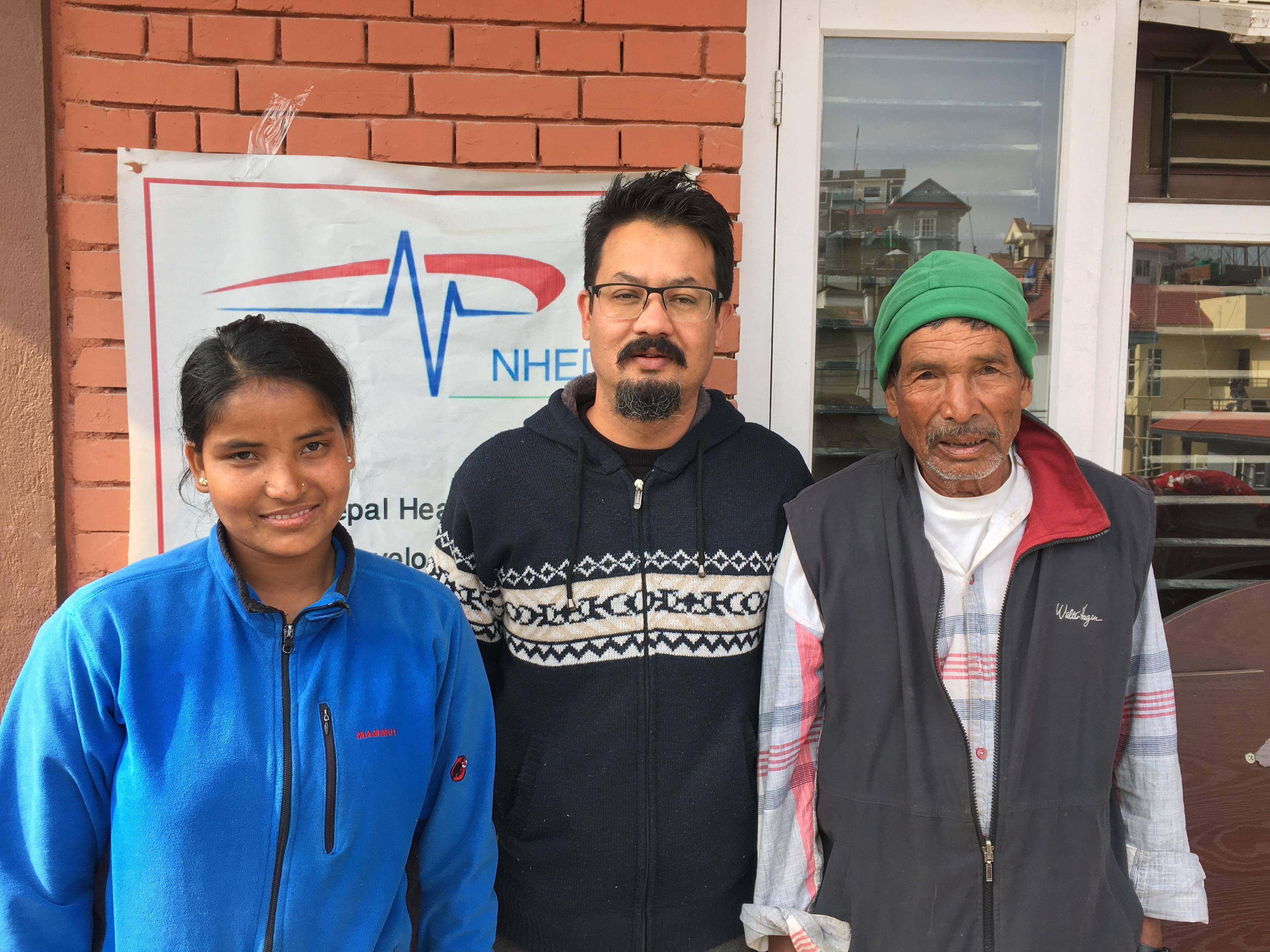 Parvati Bohara (left), chair of NHEDF Samrat Basnet (centre), and Tara Bohara pose for a photograph after treatment, in Kathmandu. Photo: Prakash Singh 