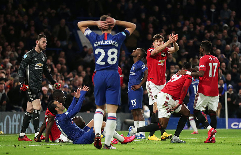 Manchester United's Harry Maguire reacts as Chelsea's Michy Batshuayi, Pedro and Cesar Azpilicueta look dejected during the Premier League match between Chelsea and Manchester United, at Stamford Bridge, in London, Britain, on February 17, 2020. Photo: Reuters