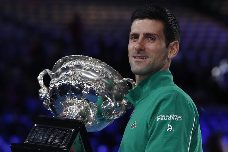 Serbia's Novak Djokovic celebrates with the trophy after winning his match against Austria's Dominic Thiem. Photo: Reuters