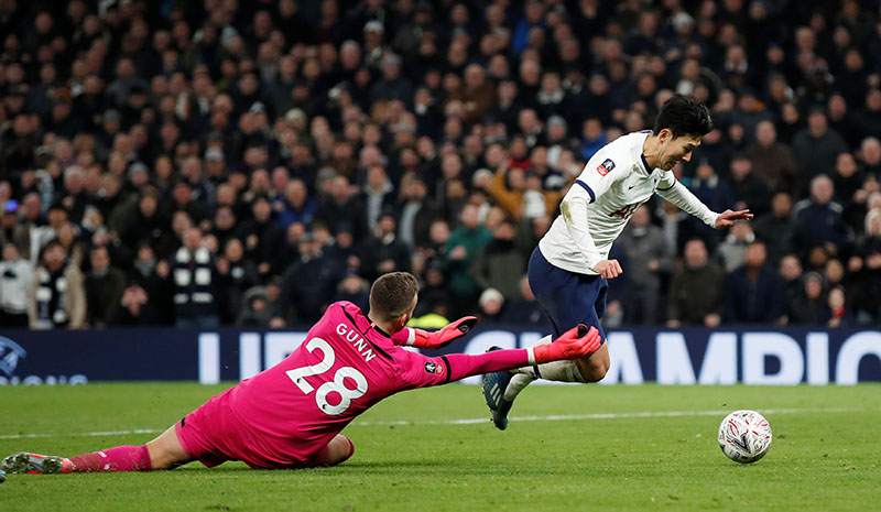 Tottenham Hotspur's Son Heung-min is fouled by Southampton's Angus Gunn resulting in a penalty during the FA Cup Fourth Round Replay match between Tottenham Hotspur and Southampton, at Tottenham Hotspur Stadium, in London, Britain, on February 5, 2020. Photo: Reuters