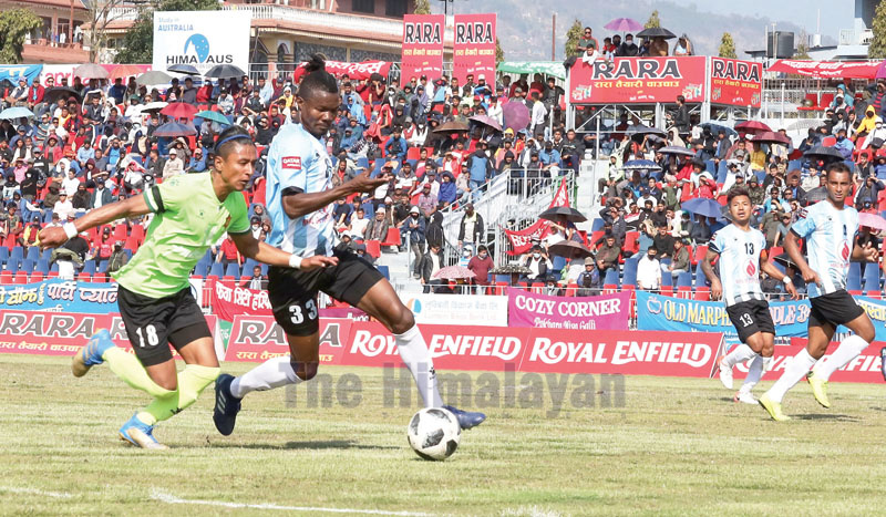 Tribhuvan Army Clubu2019s Nawayug Shrestha (left) and Florent of NOC Manang Marshyangdi Club vie for the ball during their 18th Aaha-Rara Gold Cup match in Pokhara on Thursday. Photo courtesy: Sudarshan Ranjit