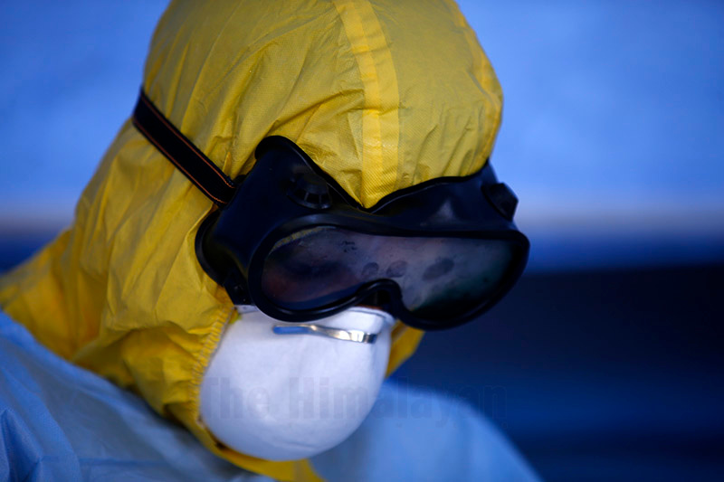 A Nepal Army personnel wears a protective suit for a demonstration, amidst rising concerns of COVID-19 outbreak, at a quarantine zone, inside the Army Headquarters, in Kathmandu, on Wednesday, March 18, 2020. Photo: Skanda Gautam/THT