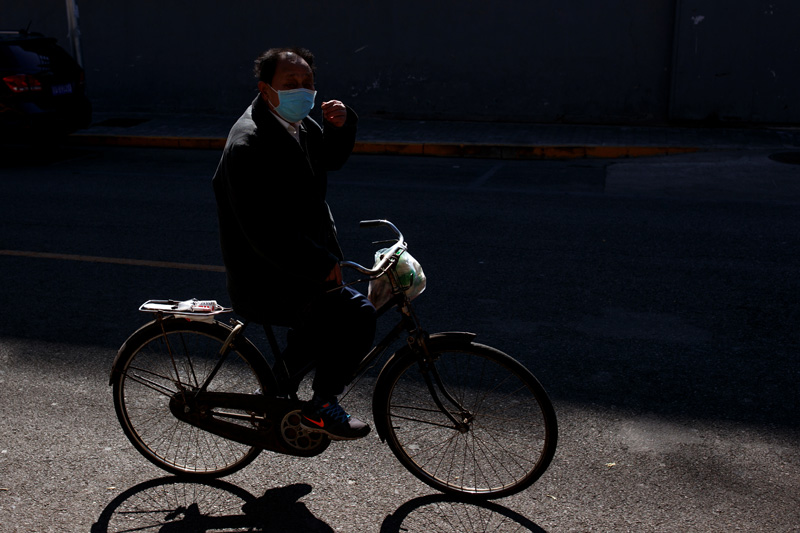A man wearing a mask cycles in Beijing, as the country is hit by an outbreak of the novel coronavirus, China, March 3, 2020. Photo: Reuters