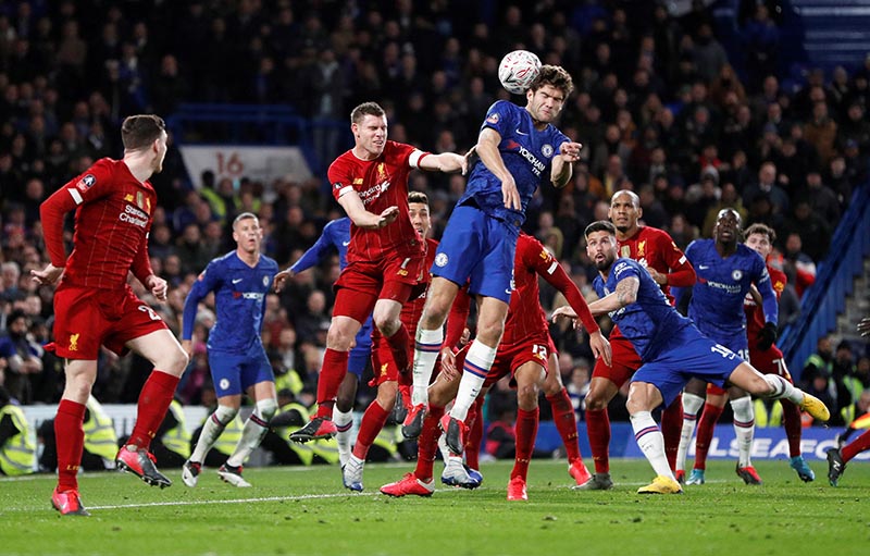 Chelsea's Marcos Alonso in action with Liverpool's James Milner during the FA Cup Fifth Round match between Chelsea and Liverpool, on Stamford Bridge, in London, Britain, on March 3, 2020. Photo: Action Images via Reuters