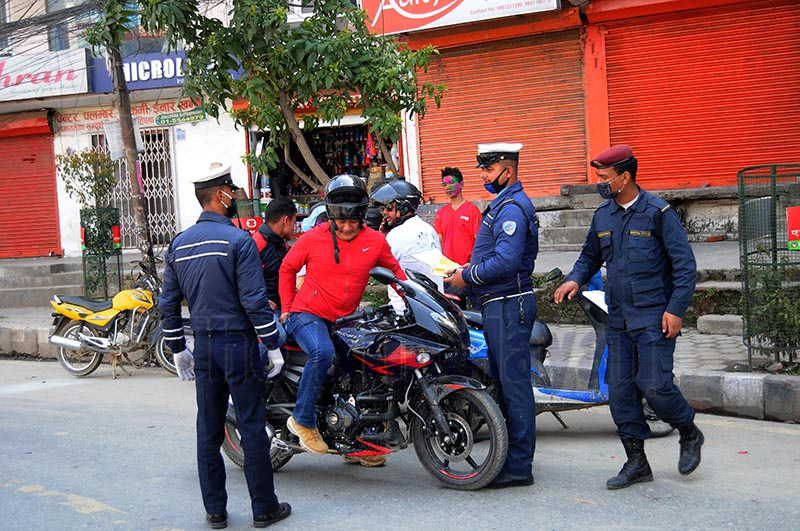Traffic police stopping bikers for special security check on the day of Holi, in Kathmandu, on Monday. Photo: Balkrishna Thapa / THT