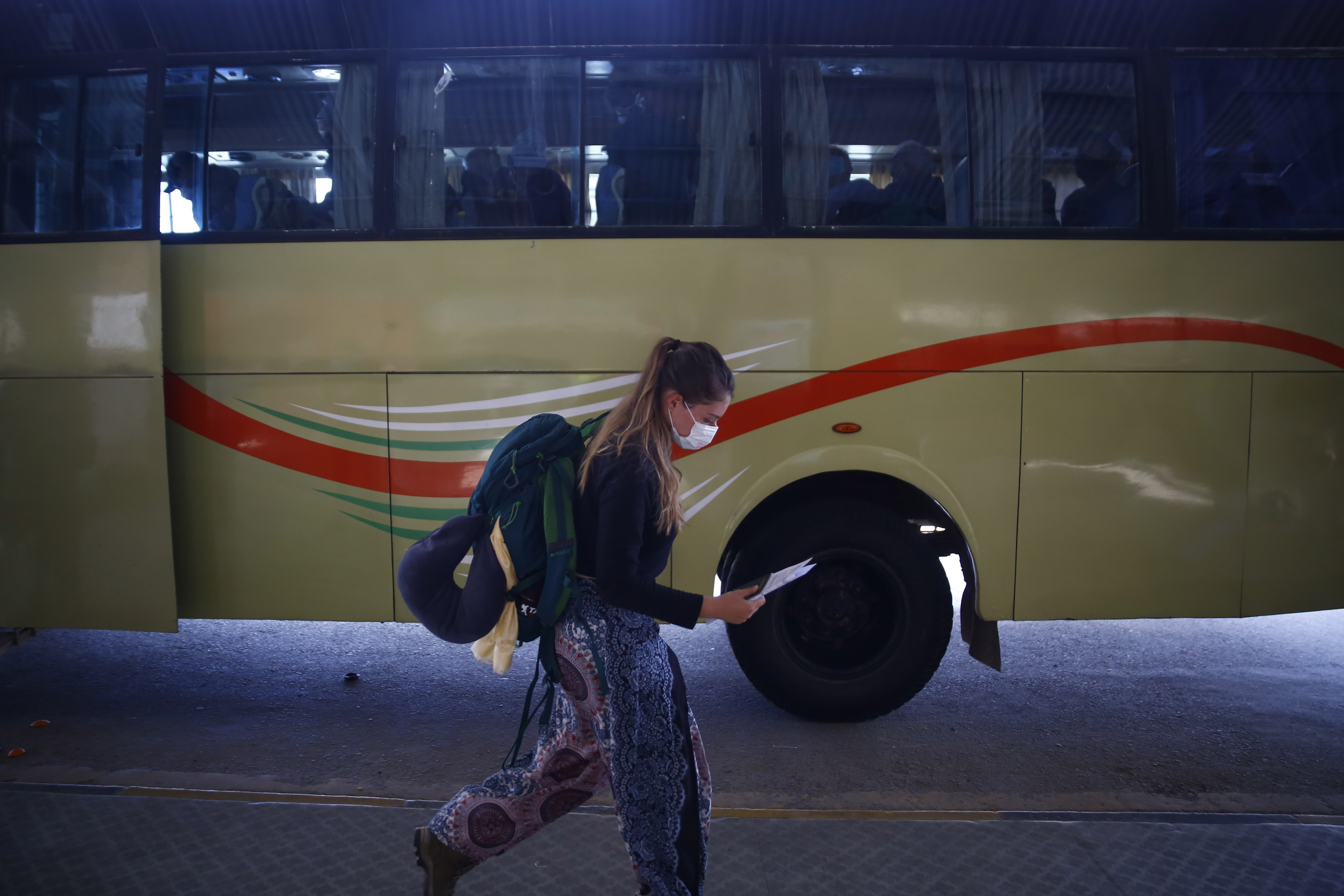 An American citizen waits for her return flight home on the eighth day of government-imposed-lockdown, amid concerns over coronavirus pandemic, at Tribhuvan International Airport, in Kathmandu, on Tuesday, March 31, 2020. Photo: Skanda Gautam/THT