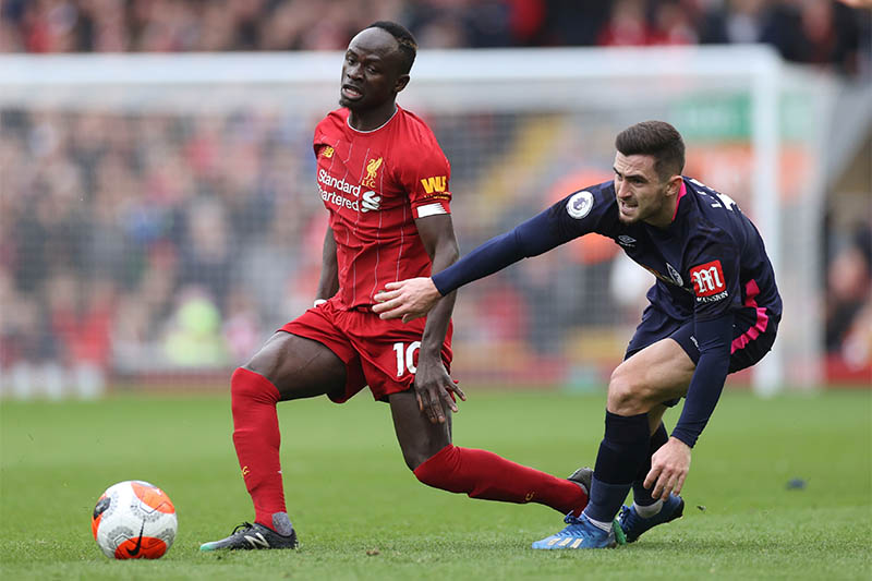 Liverpool's Sadio Mane in action with Bournemouth's Lewis Cook. Photo: Reuters