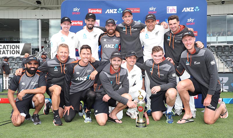 New Zealand team pose with the Royal Stag trophy at the finish of the Second Test. Photo: Reuters