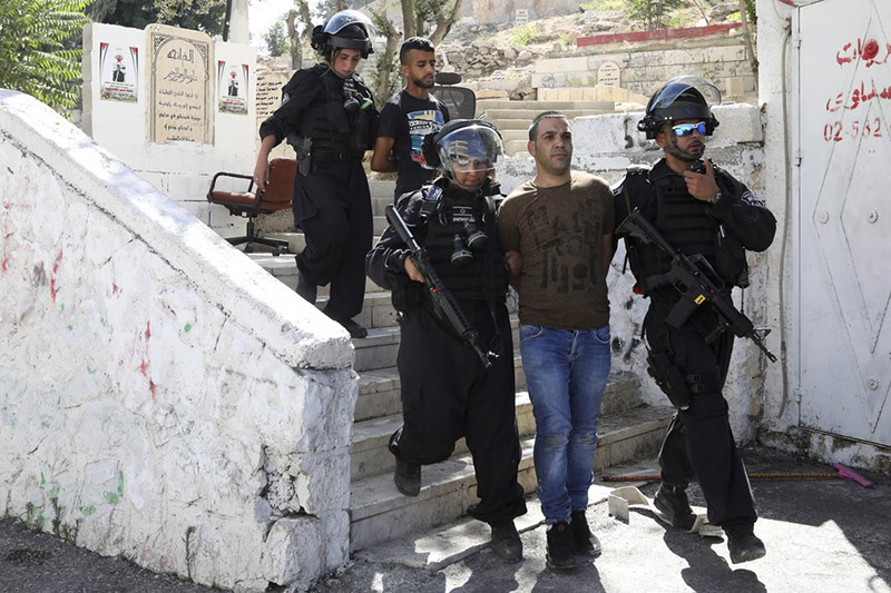 FILE - In this June 28, 2019 file photo, Israeli police arrest a Palestinian during clashes the Palestinian neighbourhood of Issawiya in East Jerusalem, a day after a Palestinian was shot and killed by police during a protest in the same neighborhood. Photo: AP