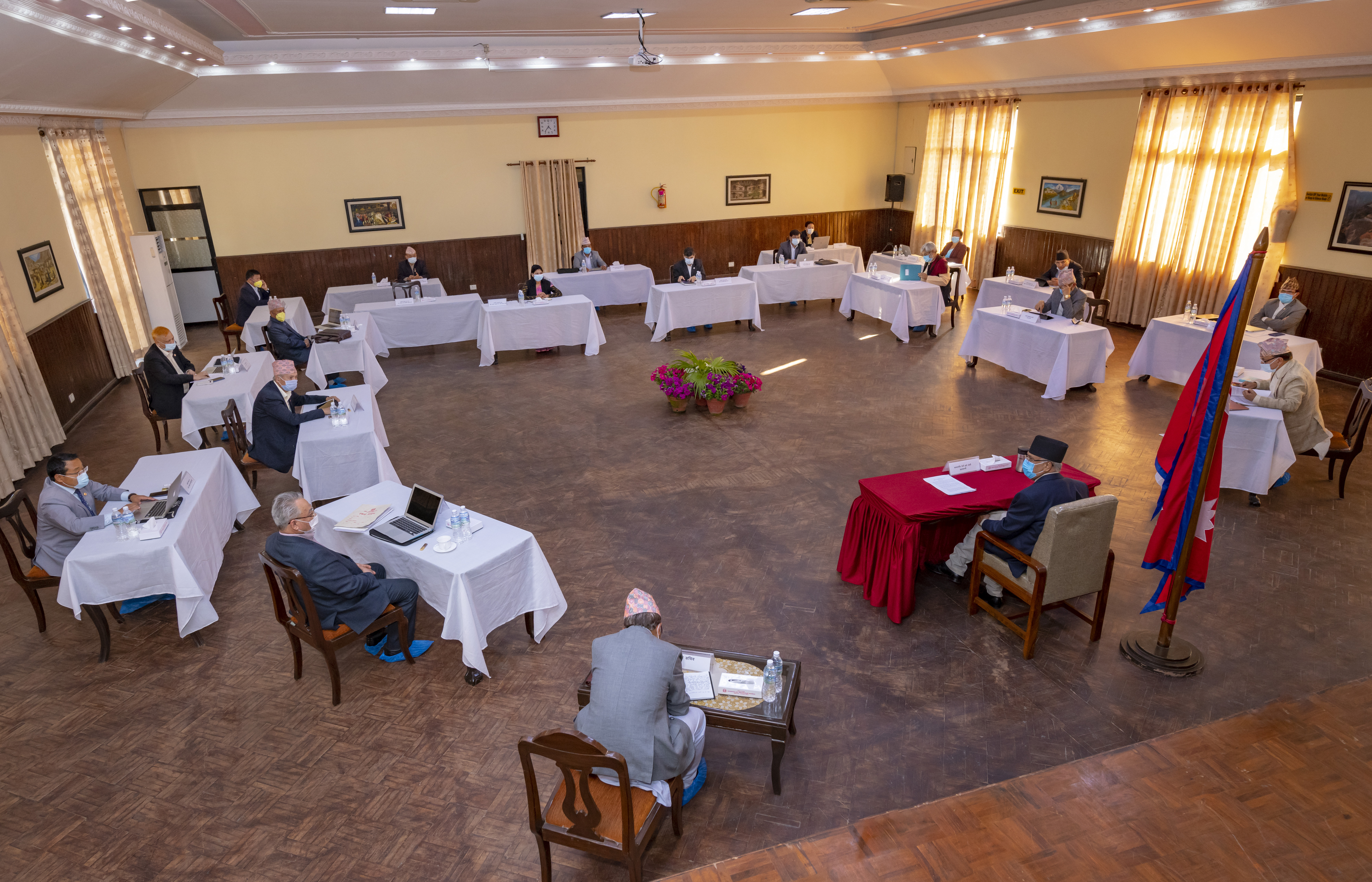 Ministers of the Cabinet are seen seated at a safe distance from one another in this picture from the cabinet meeting held at the Prime Minister's official residence, in Baluwatar, Kathmandu, on Saturday, April 4, 2020. Photo: Rajan Kafle/Secretariat of Prime Minister of Nepal