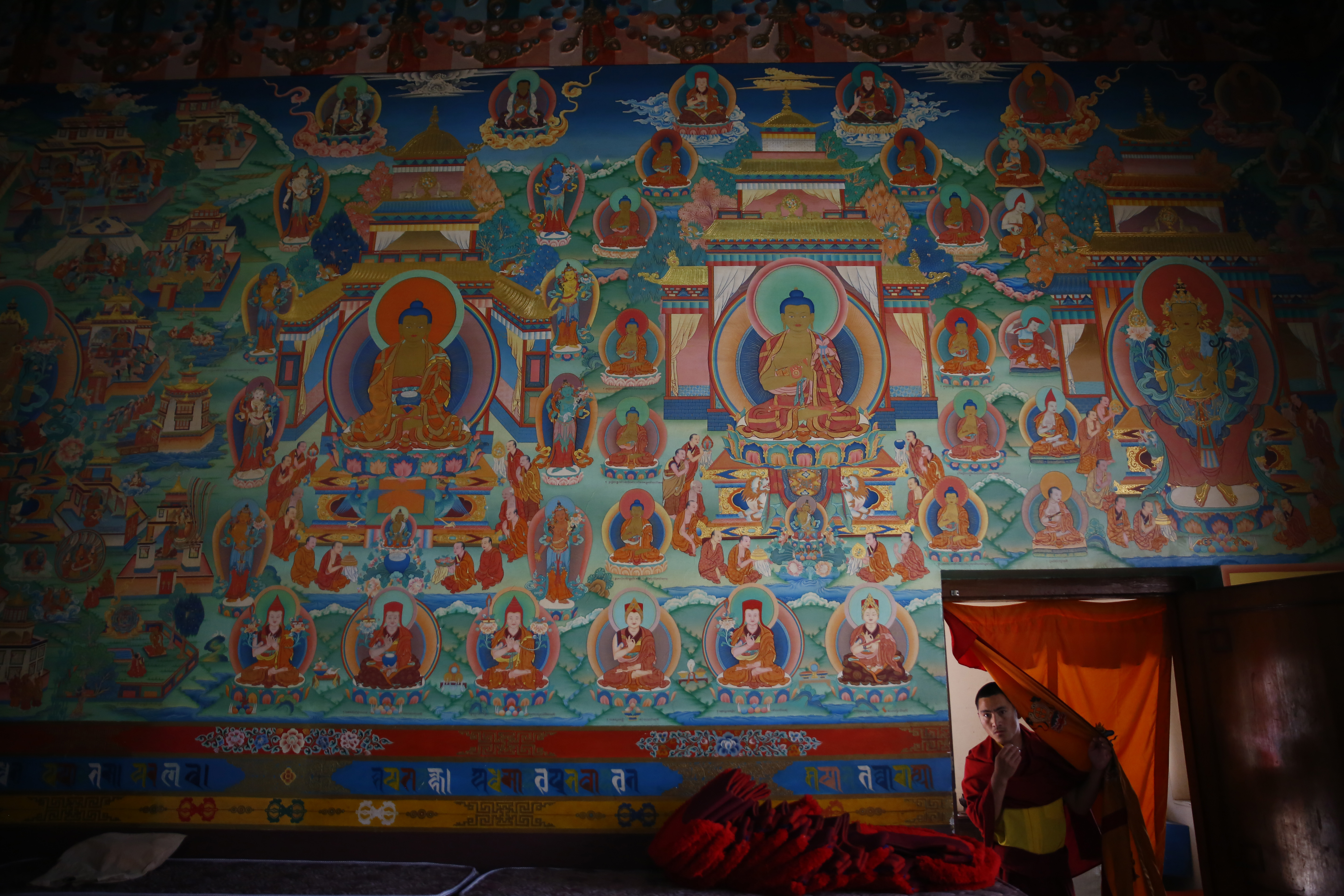 A monk is seen entering a monastery before the beginning of a special prayer service in remembrance of those who lost their lives to COVID-19. This picture was taken in Kathmandu, on Sunday, April 05, 2020. Photo: Skanda Gautam/ THT