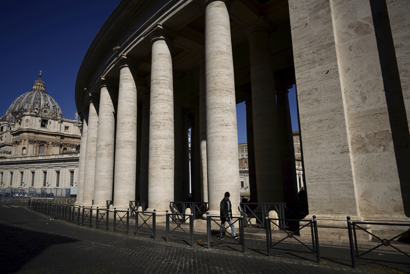 A man walks by Bernini's colonnade in St. Peter's Square during Pope Francis' weekly general audience, streamed by the Vatican television due to restrictions to contain the Covid-19 virus, at the Vatican, Wednesday, April 1, 2020.  Photo: AP