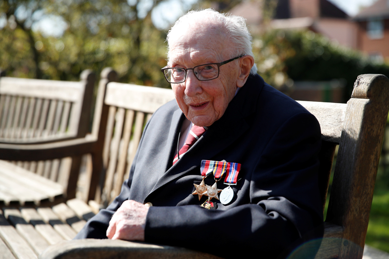 Retired British Army Captain Tom Moore, 99, poses after he continued to raise money for health workers, by attempting to walk the length of his garden one hundred times before his 100th birthday this month as the spread of coronavirus disease (COVID-19) continues, Marston Moretaine, Britain, April 15, 2020. Photo: Reuters