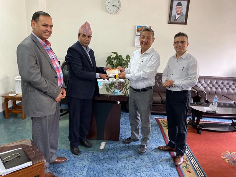Sonam Sherpa, chairman of Yeti Group handing over a cheque of Rs 10 million to the Coronavirus Infection Prevention, Control and Treatment Fund, on Thursday, April 9, 2020.