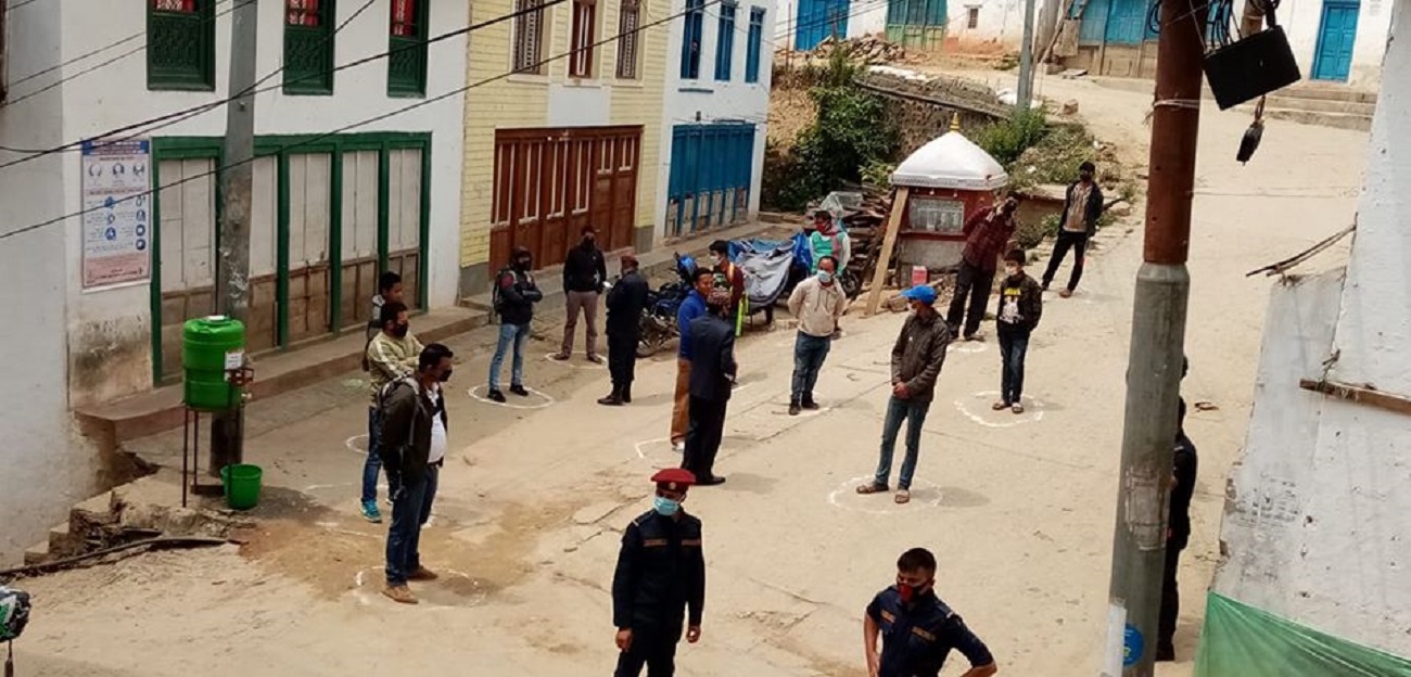 Security personnel spreading awareness regarding COVID-19 and physical distancing among the lockdown offenders, in Bhojpur, on Wednesday, April 15, 2020. Photo: Niroj Koirala/THT