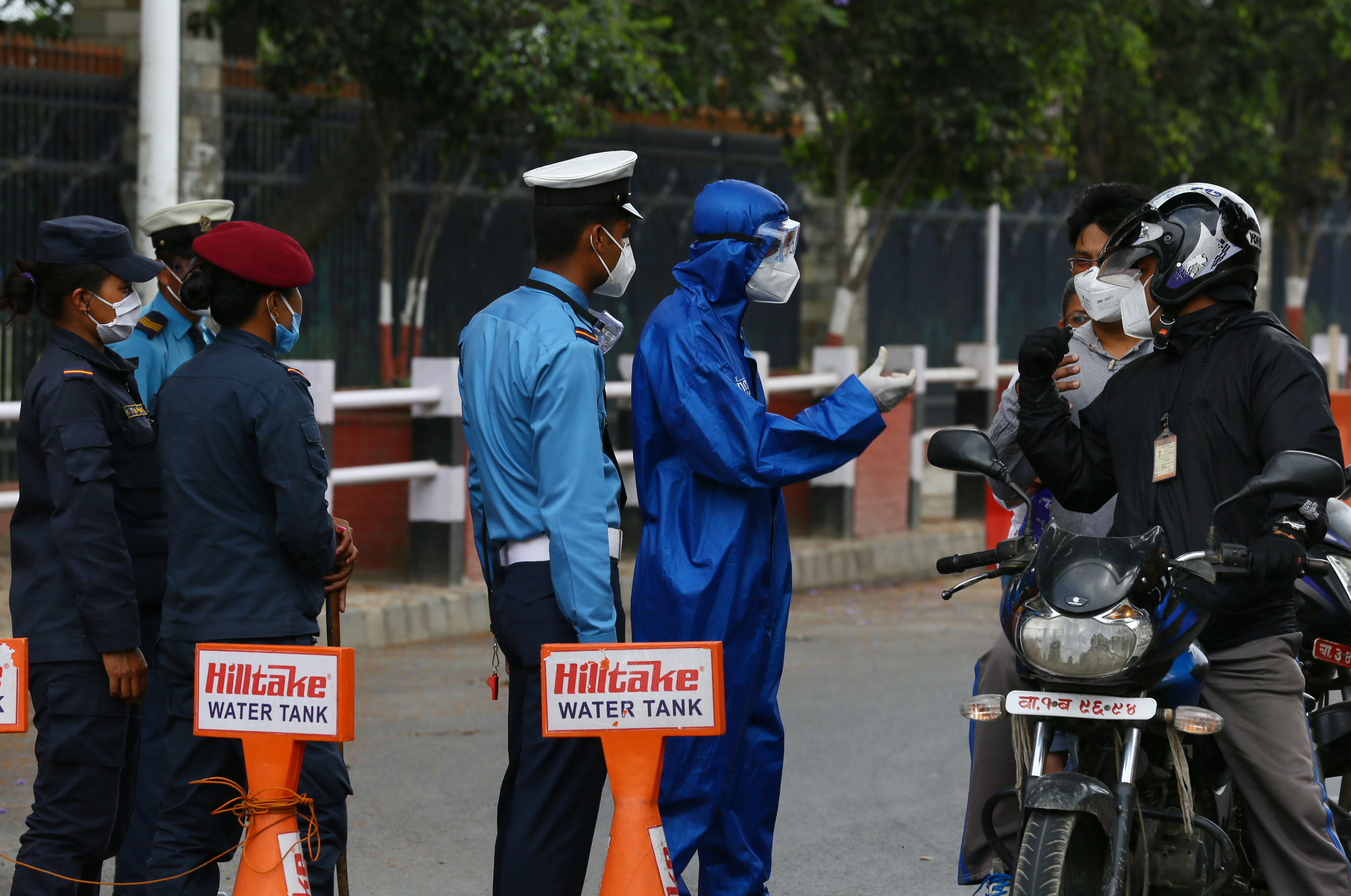 As COVID-19 transmission increases in the nation, traffic police personnel intensify their inspection to ensure only mandatory vehicular and pedestrian movement takes place, in Kathmandu, on Saturday, May 23, 2020. Photo: Rajesh Gurung/THT