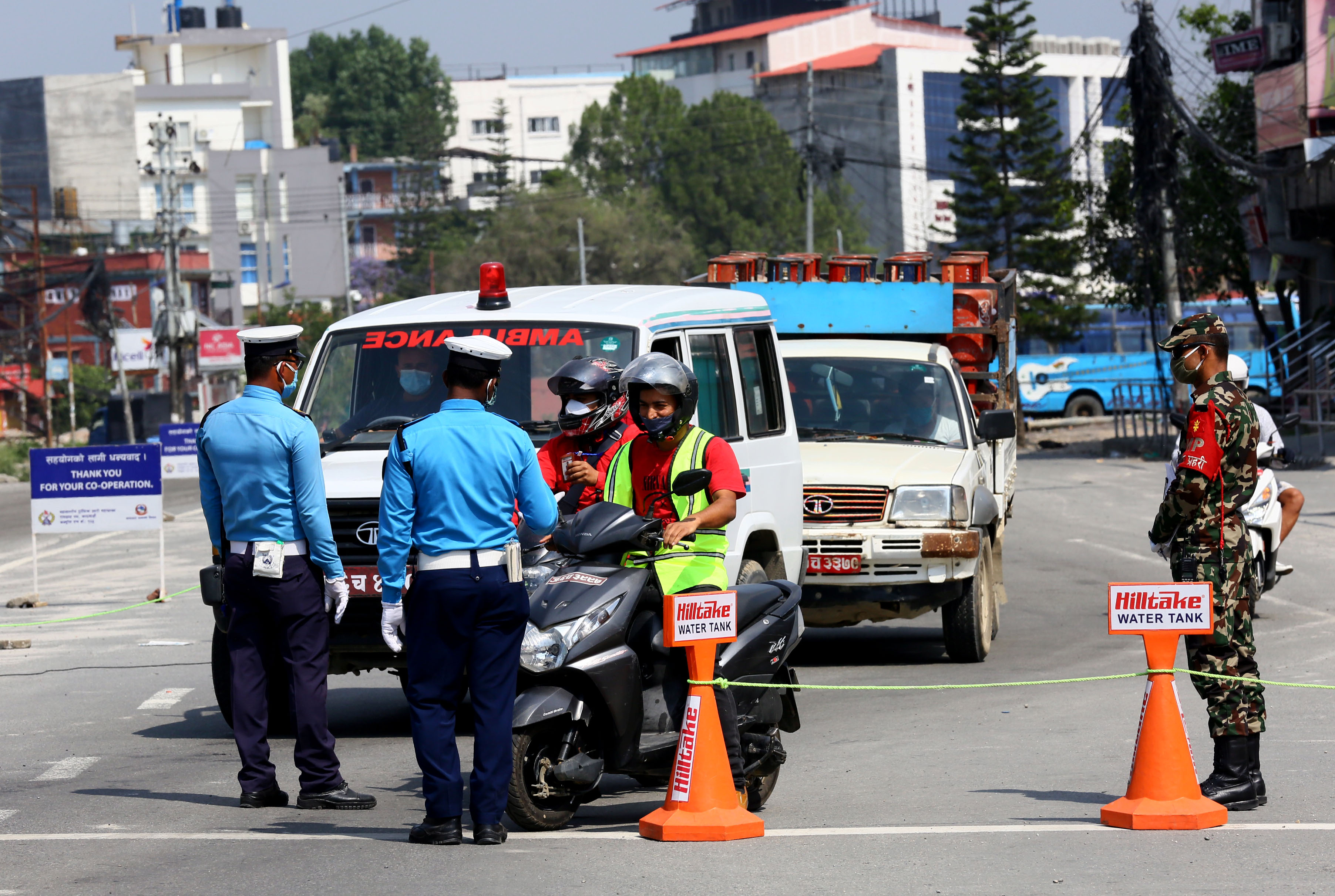 Security personnel inspecting vehicular passes in search for those defying the COVID-19 lockdown as seen at Narayan Gopal Chowk, in Kathmandu, on Sunday, May 17, 2020. Photo: Rajesh Gurung/THT
