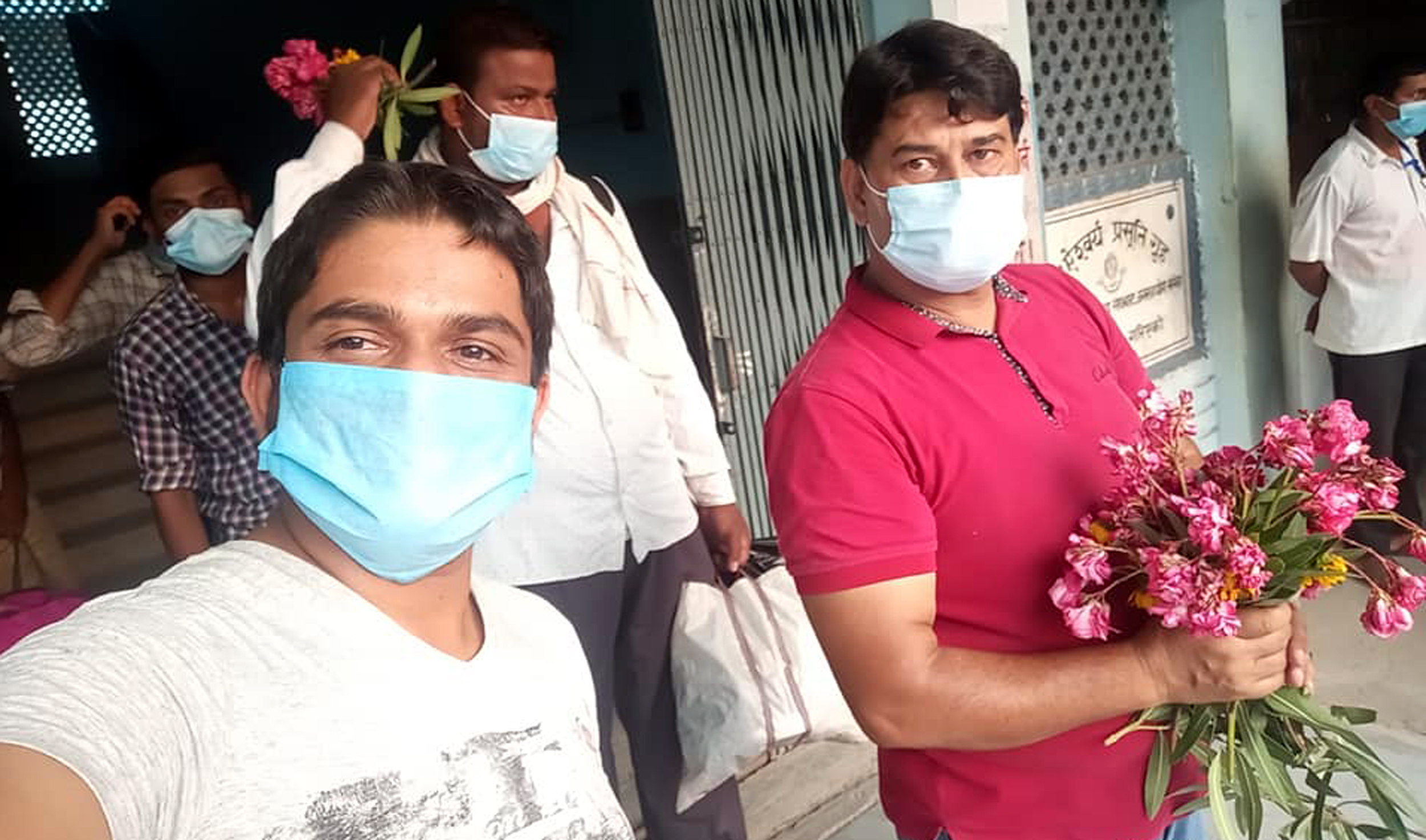 Persons infected with coronavirus pose for selfie as they leave the hospital after recovering from the disease in Birgunj, on Monday, May 25, 2020. Photo: Ram Sarraf/THT