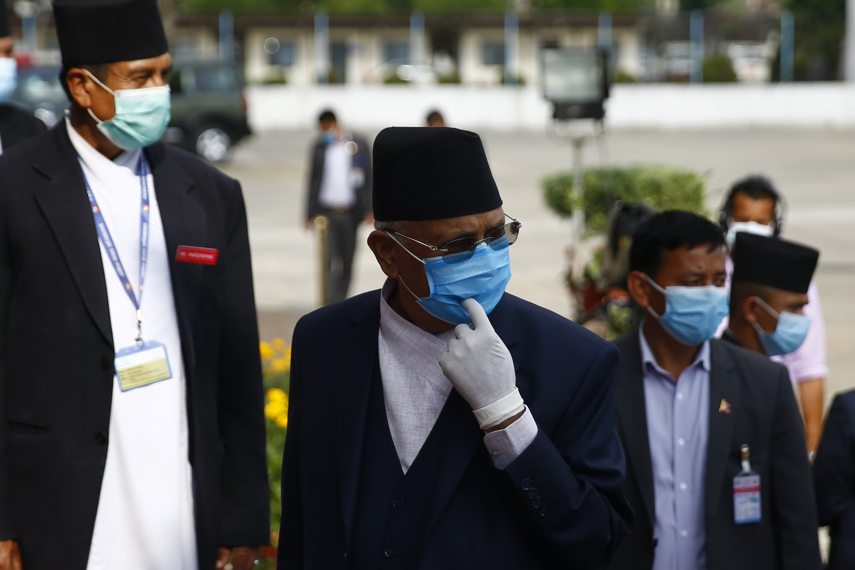 Prime Minister KP Sharma Oli waits for Finance Minister Yubaraj Khatiwada with the new government's budget for fiscal of 2020-21 at the joint meeting of House of Representatives and the National Assembly at Federal Parliament in Kathmandu, Nepal on Thursday, May 28, 2020.