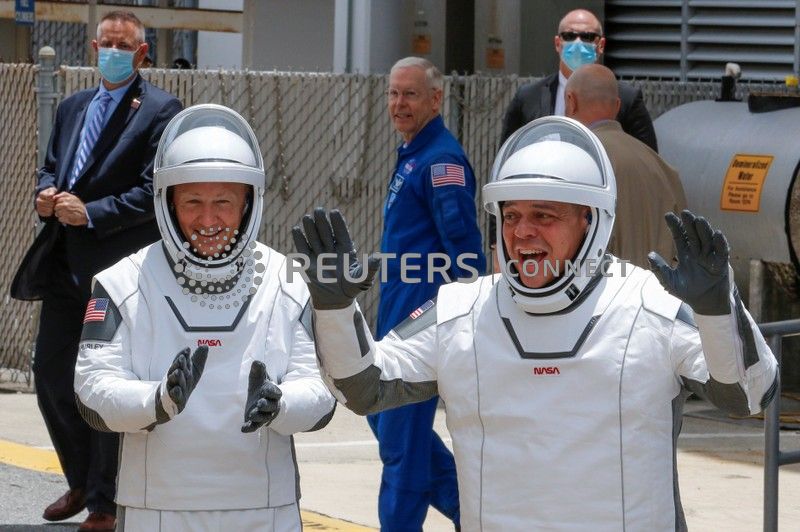 NASA astronauts Douglas Hurley and Robert Behnken head to launch Pad39A to board a SpaceX Falcon 9 rocket during NASA's SpaceX Demo-2 mission to the International Space  Station from NASA's Kennedy Space Center in Cape Canaveral, Florida, U.S., May 27, 2020. REUTERS/Joe Skipper