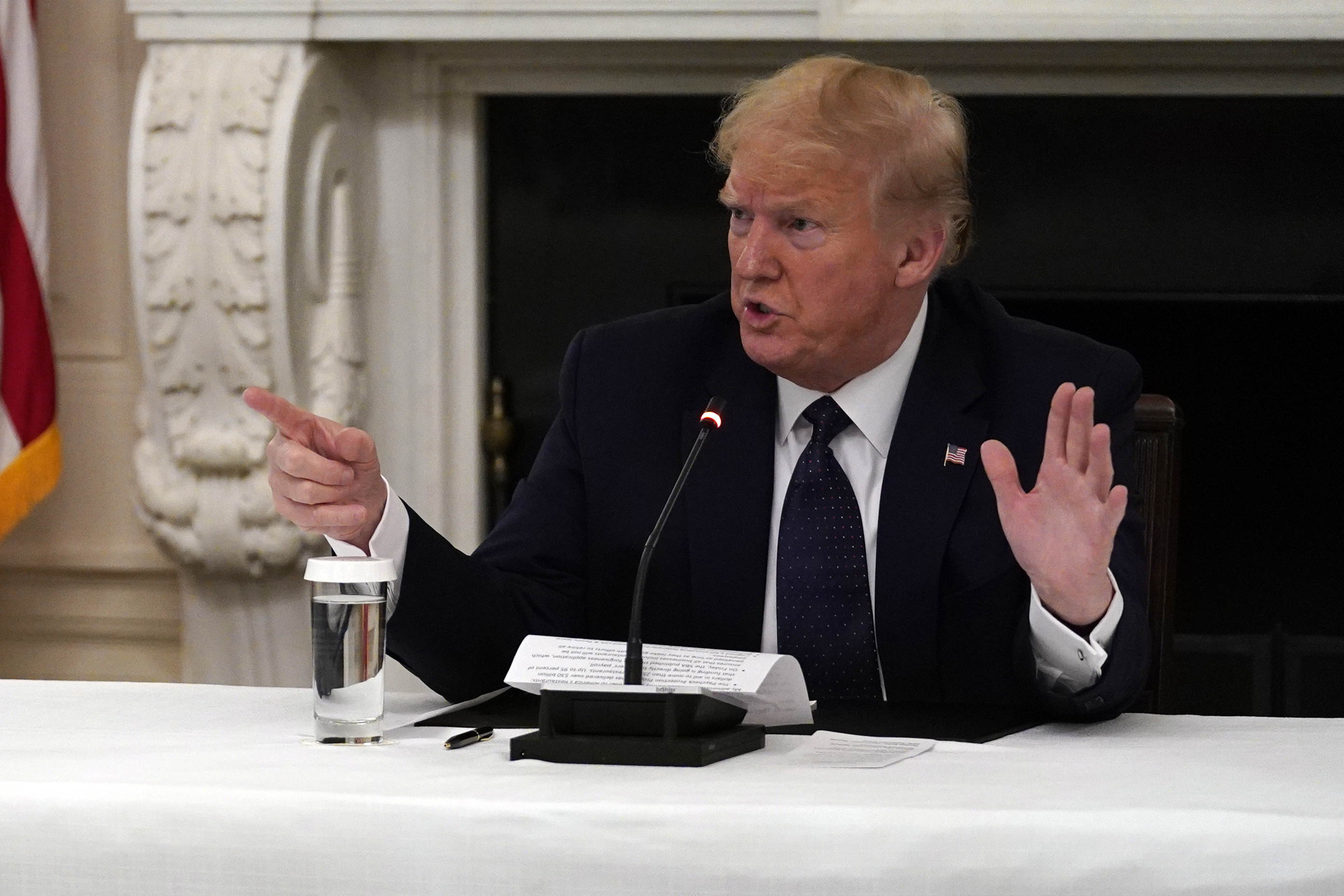 President Donald Trump tells reporters that he is taking zinc and hydroxychloroquine during a meeting with restaurant industry executives about the coronavirus response, in the State Dining Room of the White House, Monday, May 18, 2020, in Washington. (AP Photo/Evan Vucci)
