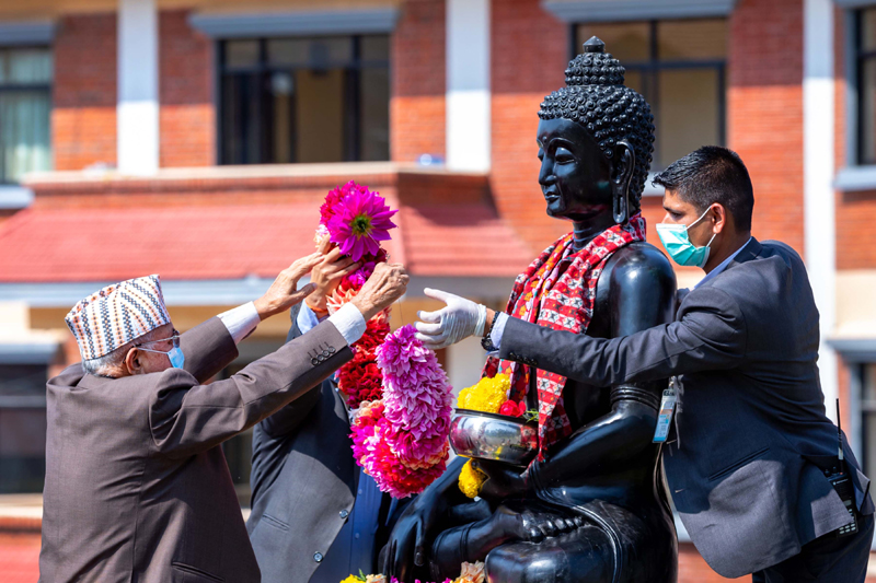 Prime Minister KP Sharma Oli offering garland to the statue of Gautam Buddha, in PM's official residence in Baluwatar, on Thursday,  May 07, 2020. Photo: Prime Minister's Secretariat