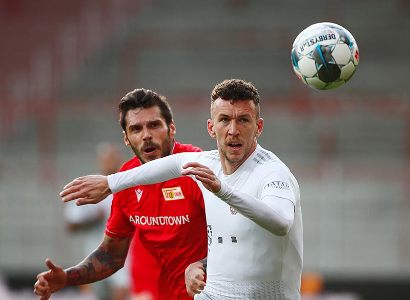 Bayern Munich's Ivan Perisic in action with FC Union Berlin's Christopher Trimmel, as play resumes behind closed doors following the outbreak of the coronavirus disease (COVID-19)  during the Bundesliga - 1 match at Stadion An der Alten Forsterei, in Berlin, Germany, on May 17, 2020. Photo: Reuters