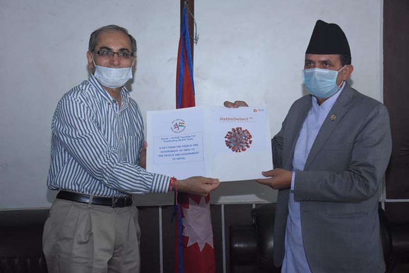 Indian Ammbassador Vinay Mihan Kwatra handing over COVID-19 PCR test kits manufactured by Mylab Pune for testing 30,000 people, to Minister of Health and Population Bhanubhakta Dhakal on Sunday, May 17, 2020. Photo Courtesy: India In Nepal/ Twitter