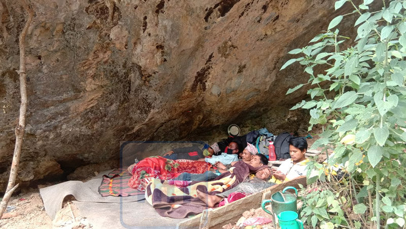 People staying in a cave during their required quarantined duration after they returned to the district during the nationwide lockdown period in Bheri Municipality-1 of Jajarkot district. Photo: Dinesh Kumar Shrestha/ THT