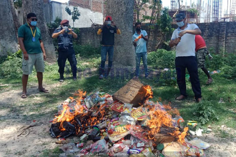 Market monitoring team destroying seized items in Siraha, on Sunday, May 10, 2020. Photo: Ashish BK/THT