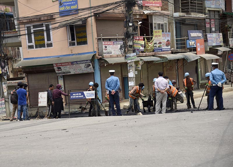 Workers tarmacking road in Gwarko, Lalitpur, on Sunday, May 24, 2020. Photo: RSS