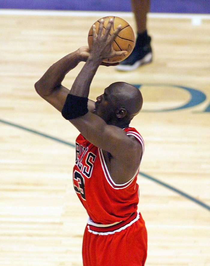 This June 14, 1998 file photo shows Chicago Bulls guard Michael Jordan shooting the game-winning shot in the closing seconds of Game 6 of an NBA Finals basketball game against the Utah Jazz in Salt Lake City to give Chicago their sixth NBA Championship. Craig Ehlo still believes he played great defense. He shared an ultimate moment with Michael Jordan, and Jordan came out on top each time. Heu0092ll be on highlight reels forever and u0093The Last Danceu0094 u0097 the ESPN and Netflix 10-part documentary series about Jordanu0092s Chicago Bulls that ends on Sunday, May 17, 2020 only freshened the familiarity fans have with two of the most-replayed shots in NBA history. Photo: Robert Deutch/USA Today via AP/file