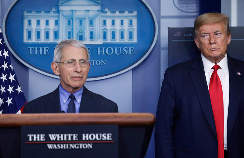 FILE PHOTO: US President Donald Trump looks at National Institute of Allergy and Infectious Diseases Director Dr. Anthony Fauci as Fauci answers a question during the daily coronavirus task force briefing at the White House in Washington, US, April 17, 2020. Photo: Reuters