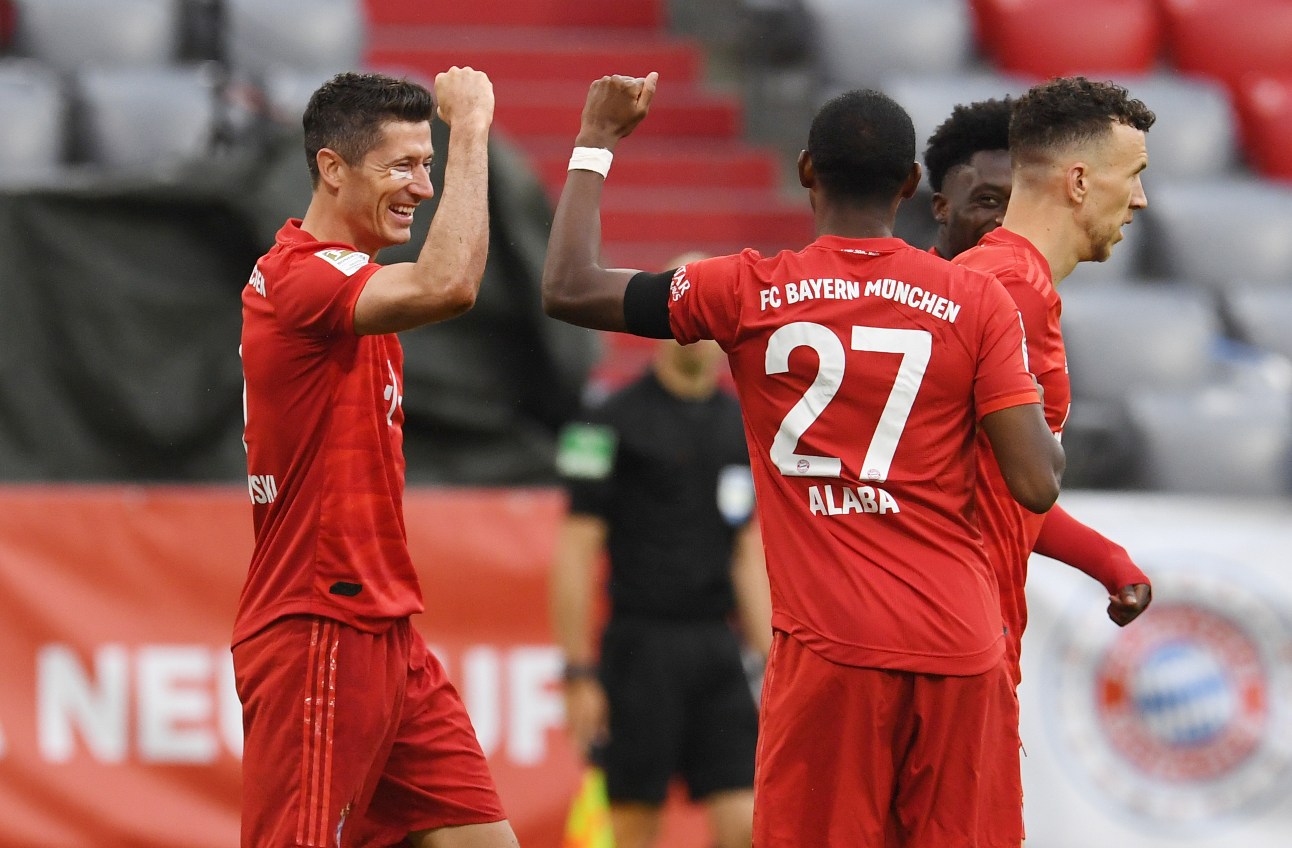 Bayern Munich's Robert Lewandowski celebrates scoring their third goal with David Alaba, as play resumes behind closed doors following the outbreak of the coronavirus disease (COVID-19)  during the Bundesliga match between Bayern Munich and Eintracht Frankfurt, at Allianz Arena, in Munich, Germany, on May 23, 2020. Photo: Reuters  