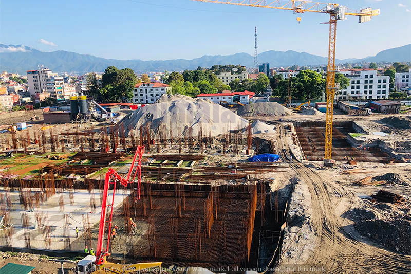 People are seen working at the under-construction site of the federal parliament building, on the premises of Singha Durbar, amid lockdown, in Kathmandu, on Monday, May 04, 2020. Photo: Mausam Shah Nepali/THT