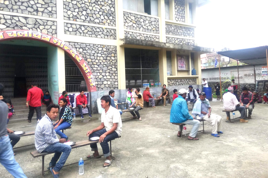 Families of daily wagers, labourers and migrant workeks are provided with free food with the initiative of Tanahun Chamber of Commerce and Industry in the Tanahun district. Photo: Madan Wagle/THT