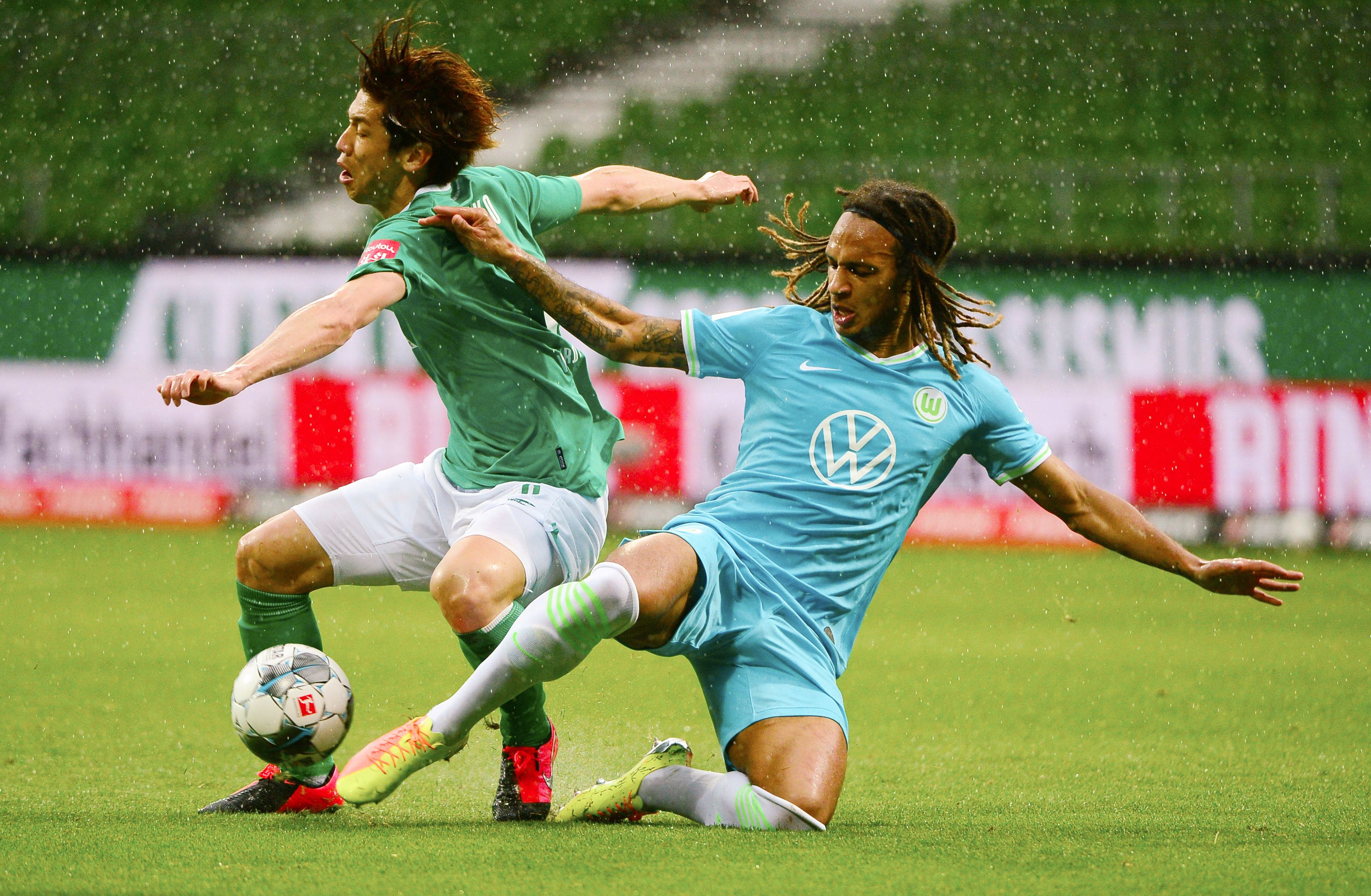 Werder Bremen's Yuya Osako in action with Wolfsburg's Kevin Mbabu, as play resumes behind closed doors following the outbreak of the coronavirus disease (COVID-19). Photo: Reuters