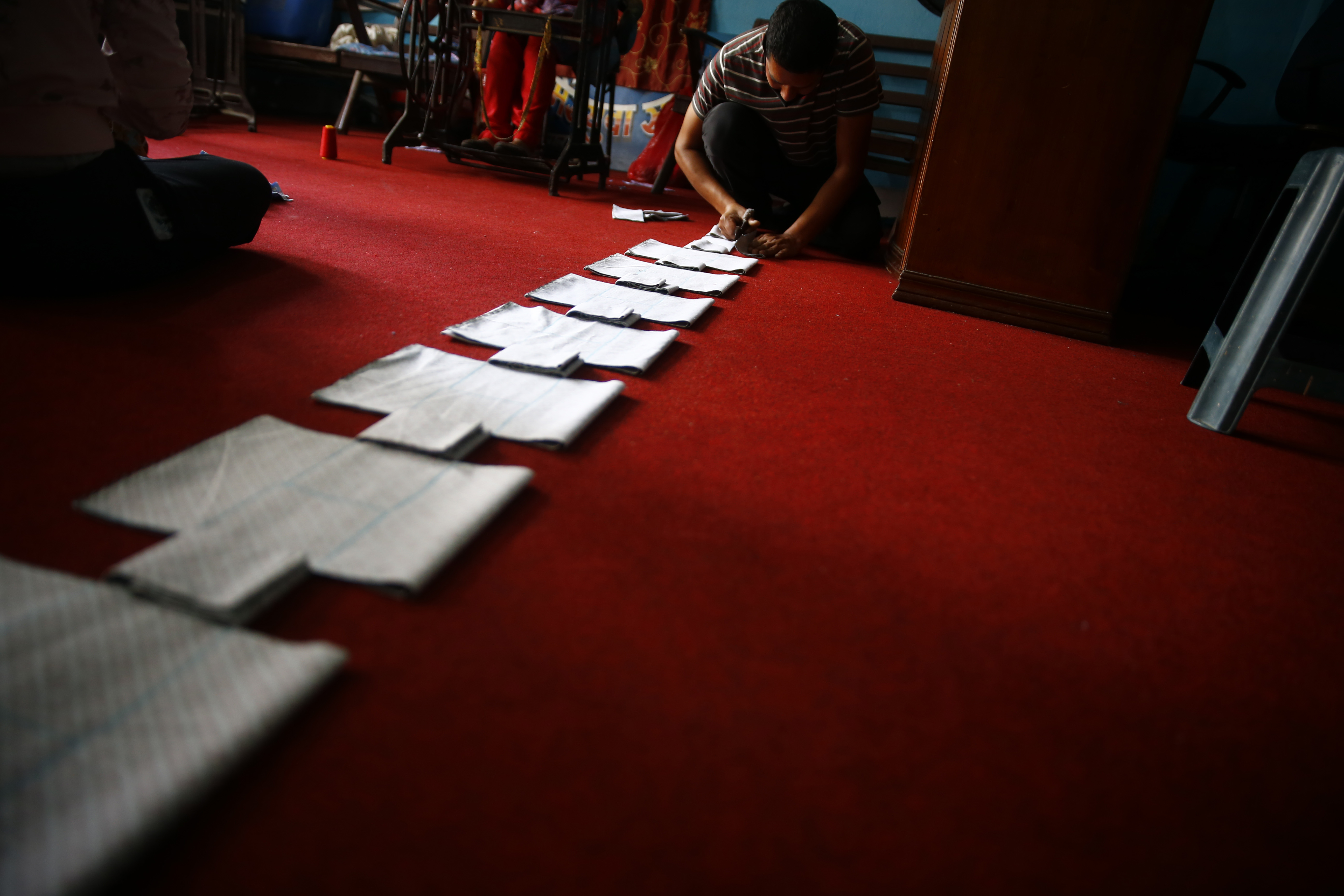 Volunteers of Mirmirey Youth Society make reusable sanitary pads at Sinamangal, in Kathmandu, on Saturday, June 06, 2020. Photo: Skanda Gautam/THT