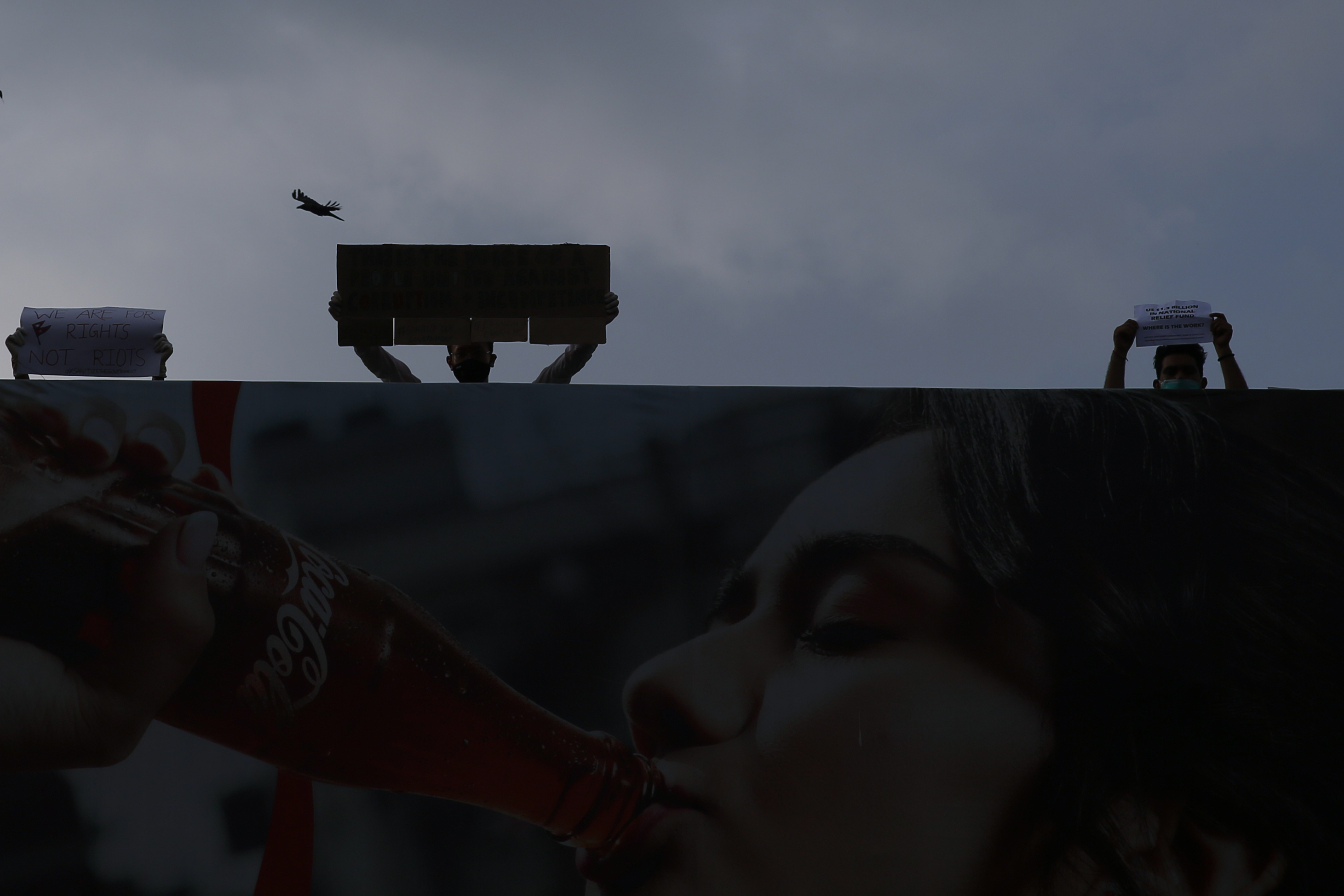 Youths hold placards during a protest against governmentu2019s ineffective handling of the coronavirus pandemic, in Lalitpur, on Friday, June 12, 2020. Photo: Skanda Gautam/THT