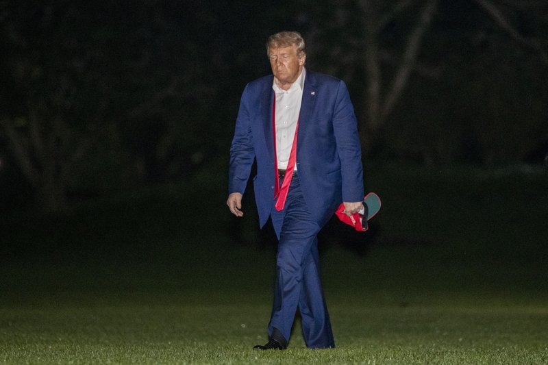 President Donald Trump walks on the South Lawn of the White House in Washington, early Sunday, June 21, 2020, after stepping off Marine One as he returns from a campaign rally in Tulsa, Okla. Photo: AP
