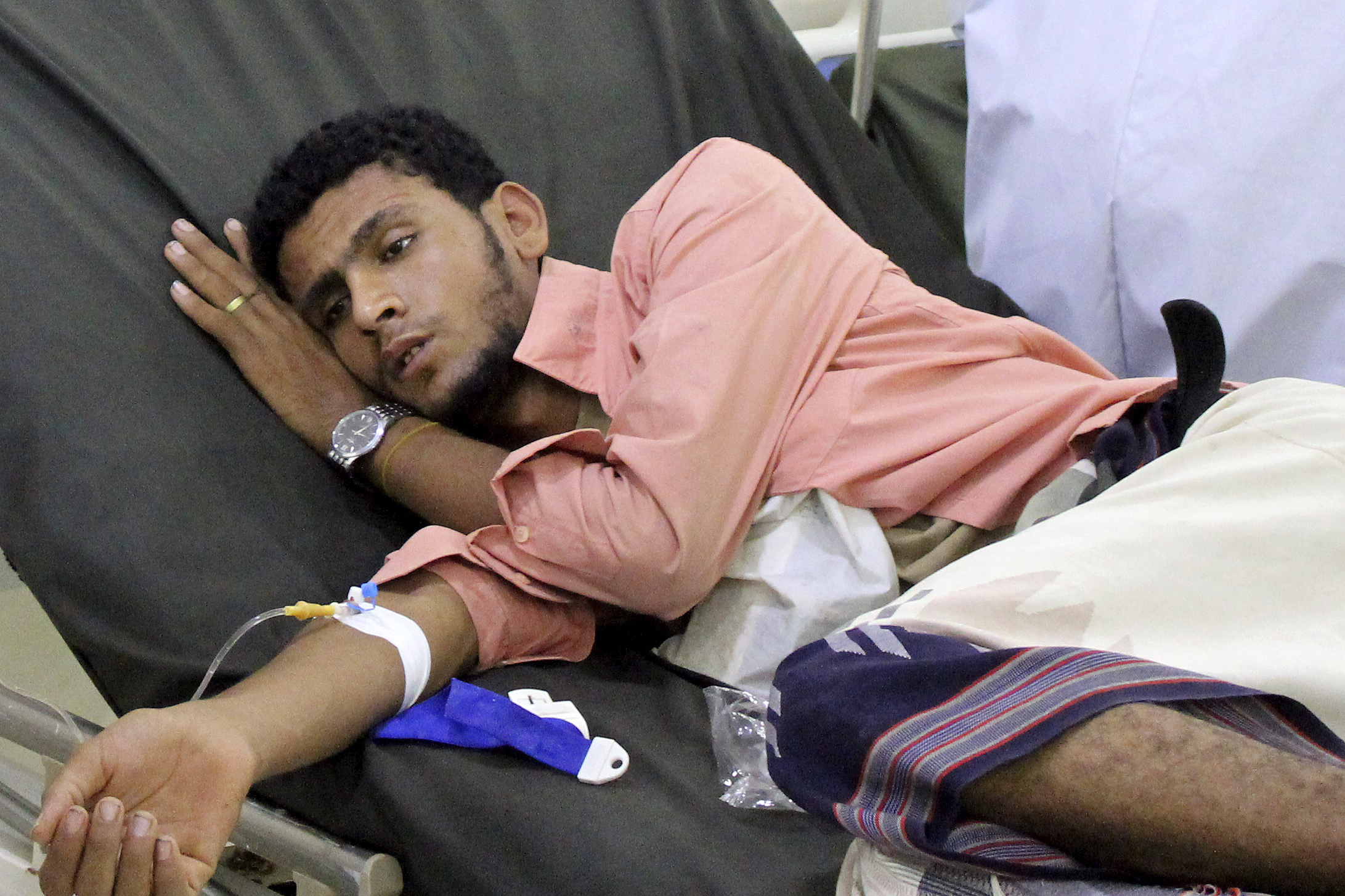 A Yemeni man receives treatment as he lies on a bed at a hospital in Aden, Yemen. Aid organizations are making an urgent plea for donations to shore up their operations in war-torn Yemen, saying theyu2019ve already been forced to stop some of their work even as the coronavirus rips through the country. The calls for funds come ahead of a UN donor conference, hosted virtually by Saudi Arabia, scheduled to take place Tuesday, June 2, 2020. Photo: AP