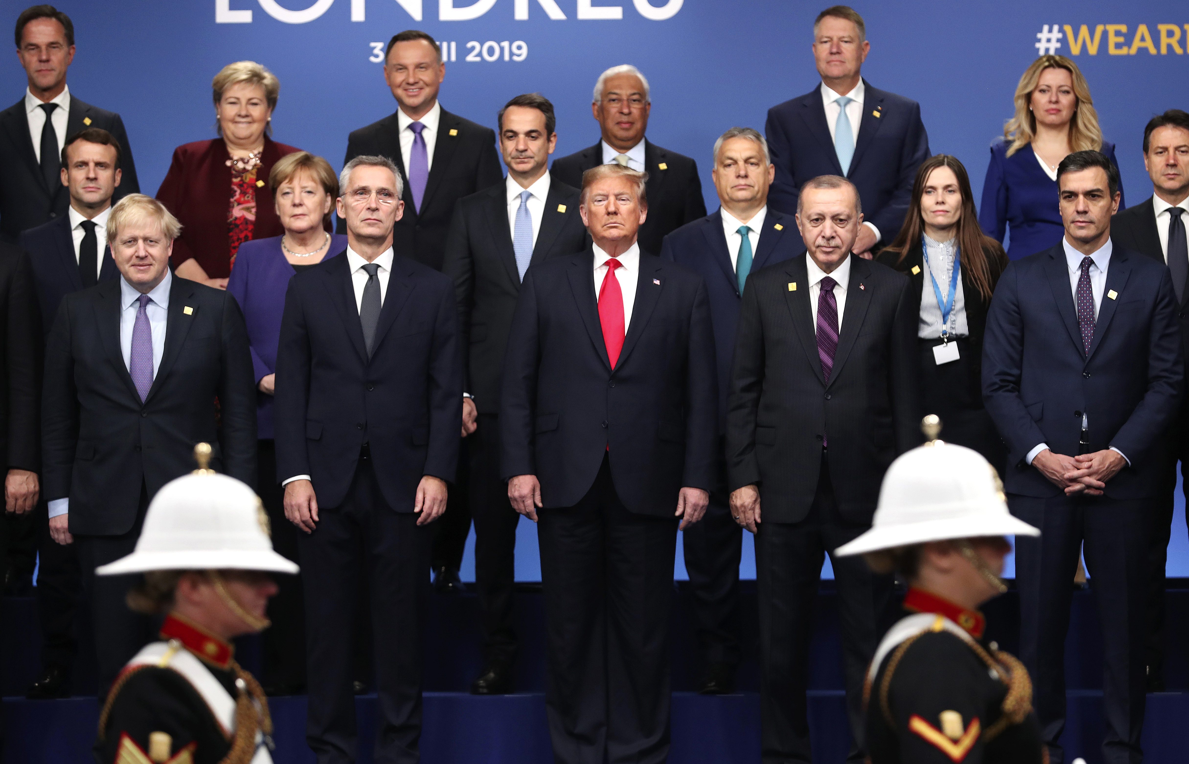 FILE - In this Dec. 4, 2019, file photo, from front row left, British Prime Minister Boris Johnson, NATO Secretary General Jens Stoltenberg, U.S. President Donald Trump, Turkish President Recep Tayyip Erdogan and Spanish Prime Minister Pedro Sanchez attend a ceremony event during a NATO leaders meeting at The Grove hotel and resort in Watford, Hertfordshire, England. People have taken to the streets around the world to demonstrate in support of Black Lives Matter protesters in the United States and to vent anger over Trumpu2019s response to the police killing of George Floyd. But leaders of traditional allies of the United States have taken pains to avoid criticizing Trump directly. Photo: AP