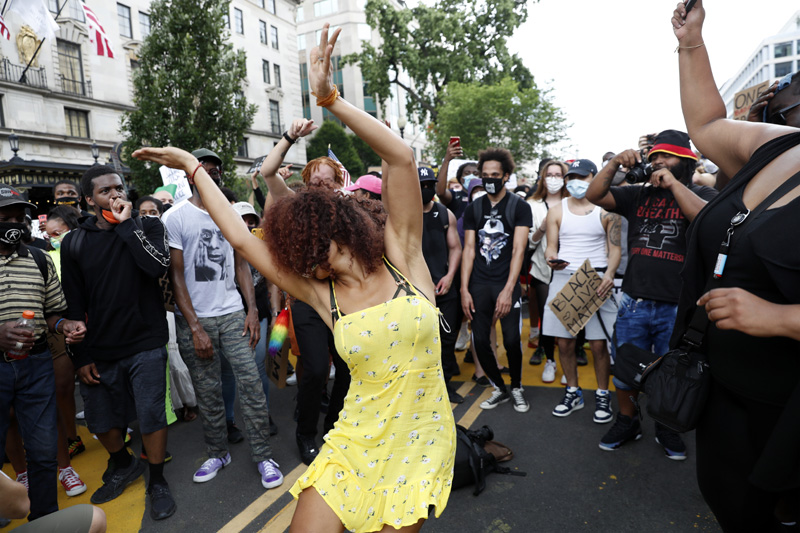 Demonstrator dance as they protest Saturday, June 6, 2020, near the White House in Washington, over the death of George Floyd, a black man who was in police custody in Minneapolis. Photo: AP