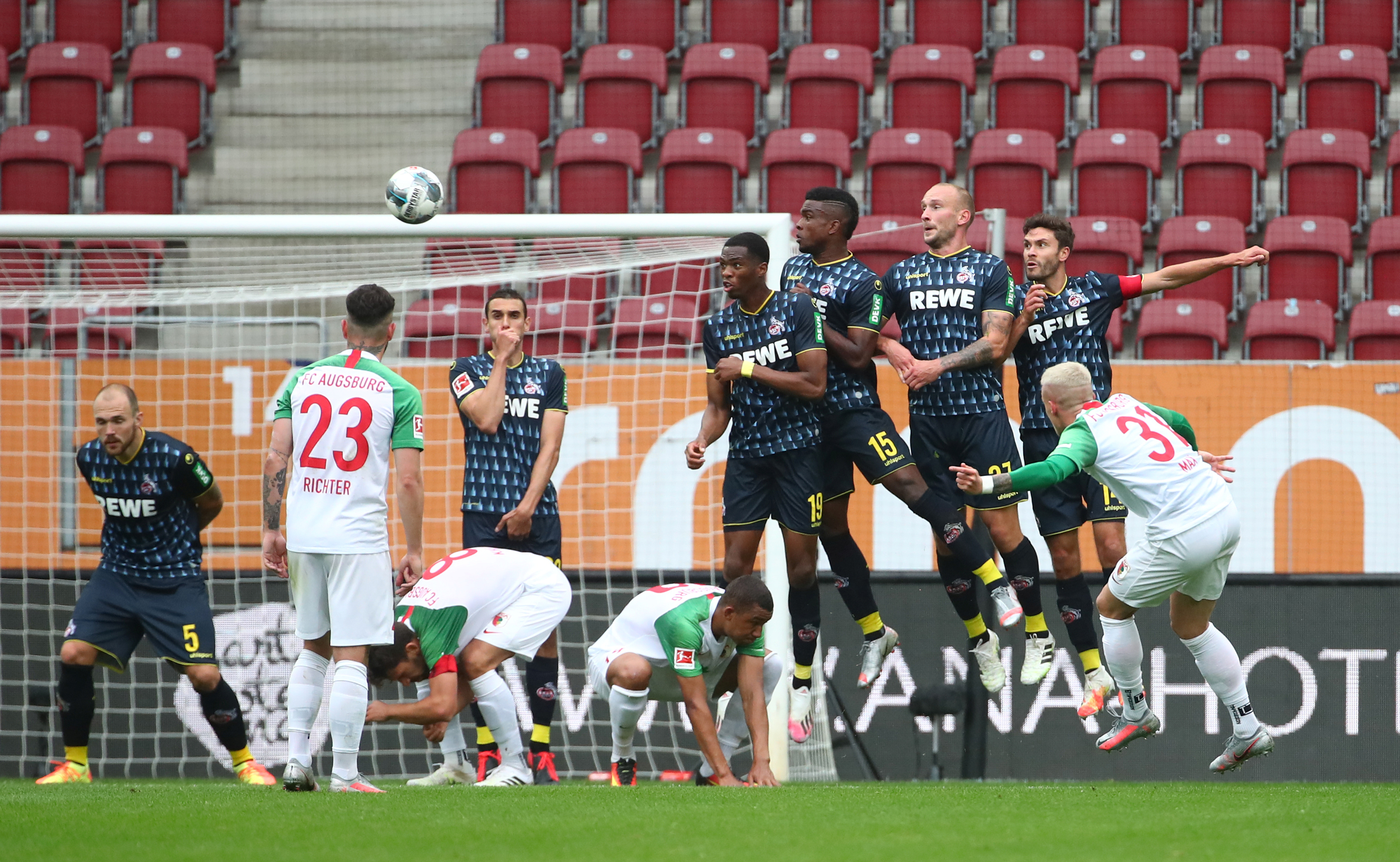 FC Augsburg's Philipp Max shoots at goal, as play resumes behind closed doors following the outbreak of the coronavirus disease (COVID-19) during the Bundesliga match between FC Augsburg and FC Cologne, at WWK Arena, in Augsburg, Germany, on June 7, 2020. Photo: Reuters
