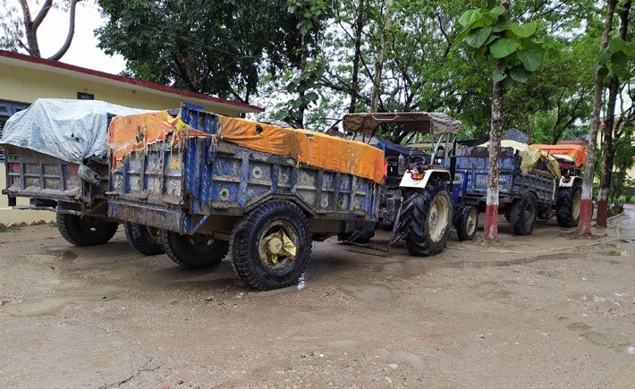 Tractors loaded with illegally extracted sand, boulders and gravel on the premises of District Police Office, Banke, on Monday. Photo: THT