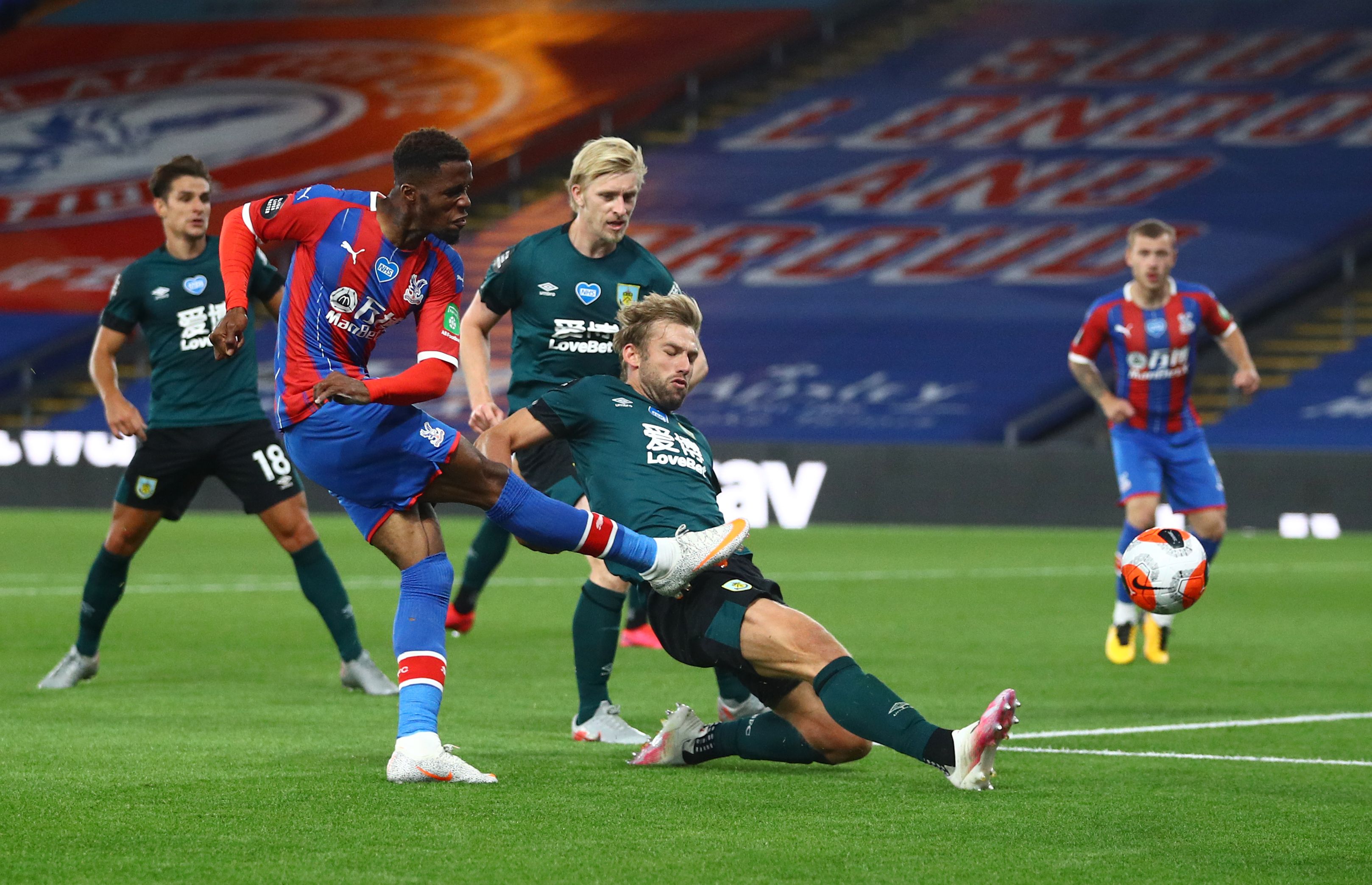 Crystal Palace's Wilfried Zaha shoots at goal, as play resumes behind closed doors following the outbreak of the coronavirus disease (COVID-19) during the Premier League match between Crystal Palace and Burnley, at Selhurst Park, in London, Britain, on June 29, 2020. Photo: Reuters