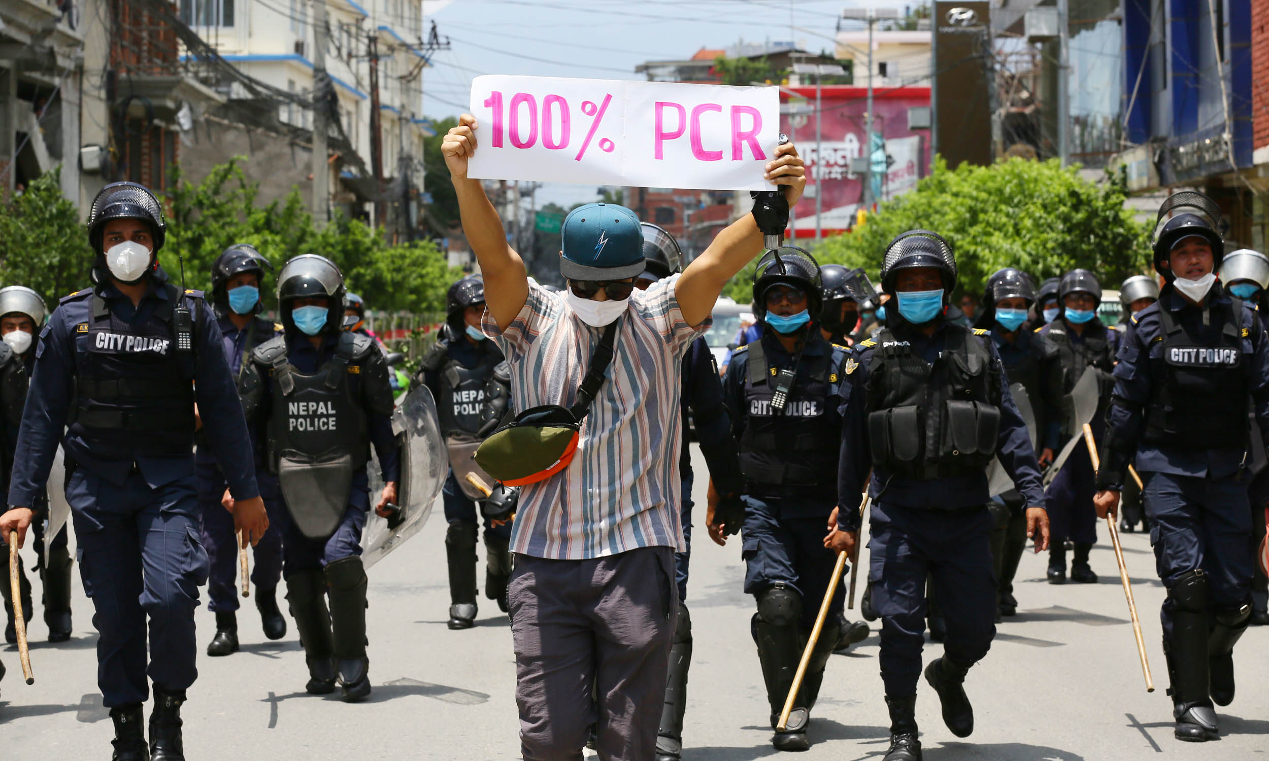 Youths gather in a protest against the government's incompetence and inaction in dealing with the coronavirus crisis in the country, as part of a nationwide protest to take place today and tomorrow, in Kathmandu, on Thursday, June 11, 2020. Photo: Rajesh Gurung/THT