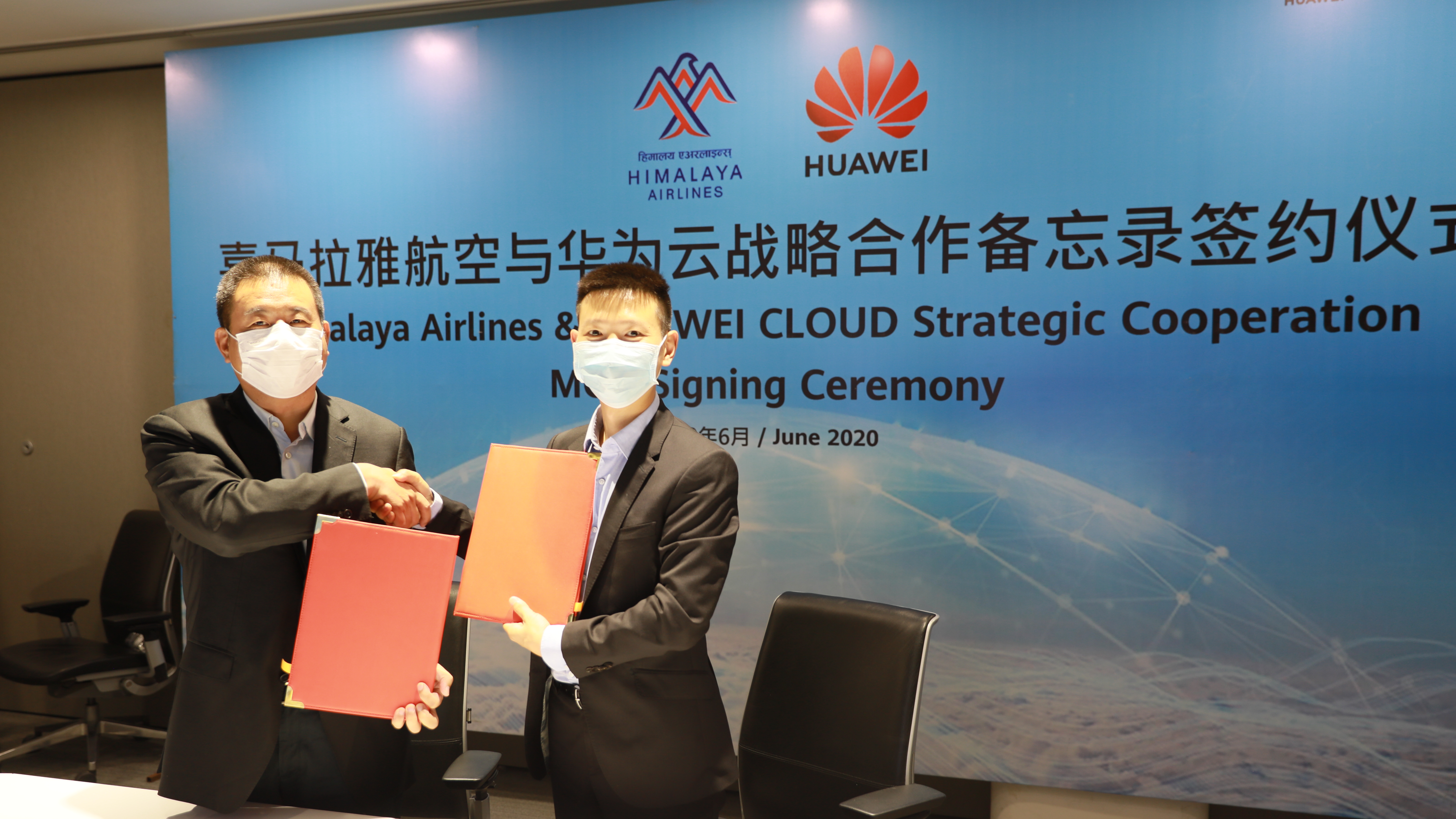 Zhou Enyong, President of Himalaya Airlines and Deng Shuigen, CEO of Huawei Technologies Nepal Co., Pvt. Ltd during a signing ceremony held at Huawei company office in Kathmandu, on Sunday, June 28, 2020. Photo Courtesy: Himalaya Airlines