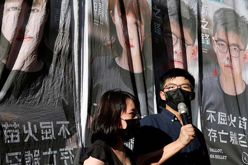 Pro-democracy activist Joshua Wong (R) announces his plans to run for legislature next to pro-democracy district councillor Jannelle Leung, in Hong Kong, China,on June 19, 2020. Photo: Reuters